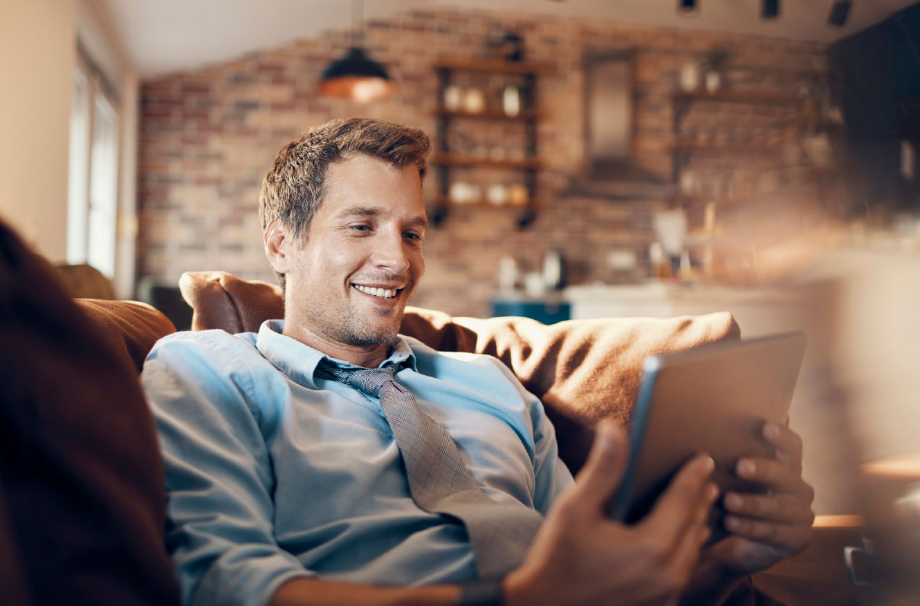 Young man using tablet in living room