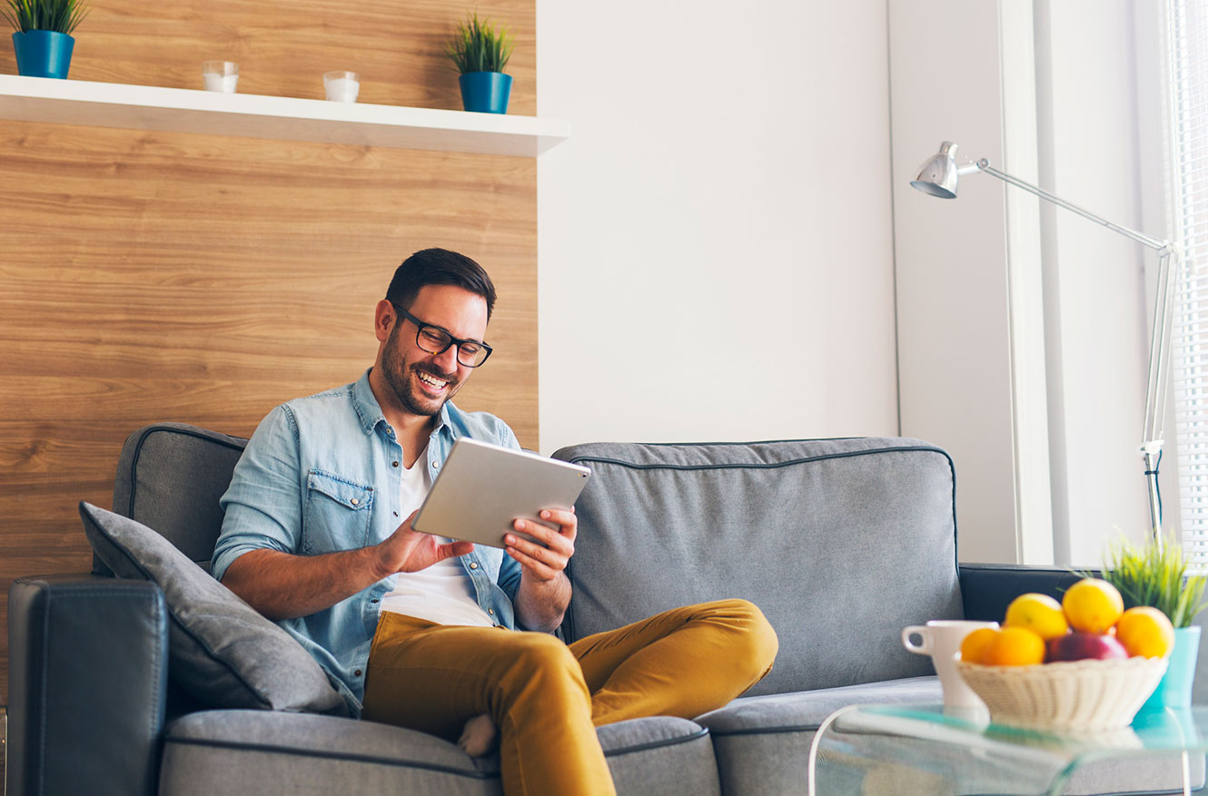 Young man using tablet in living room